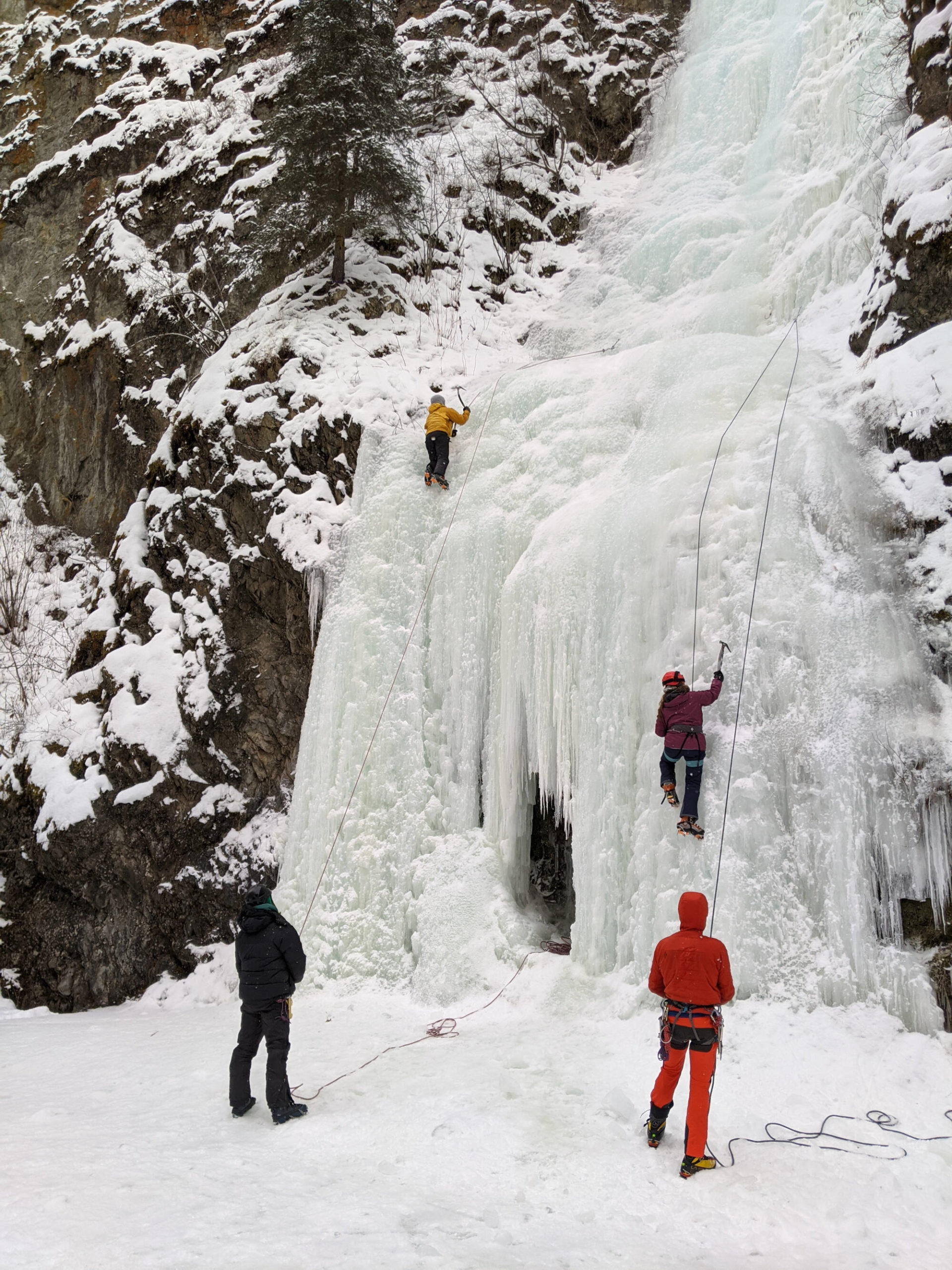group having fun ice climbing in alaska
