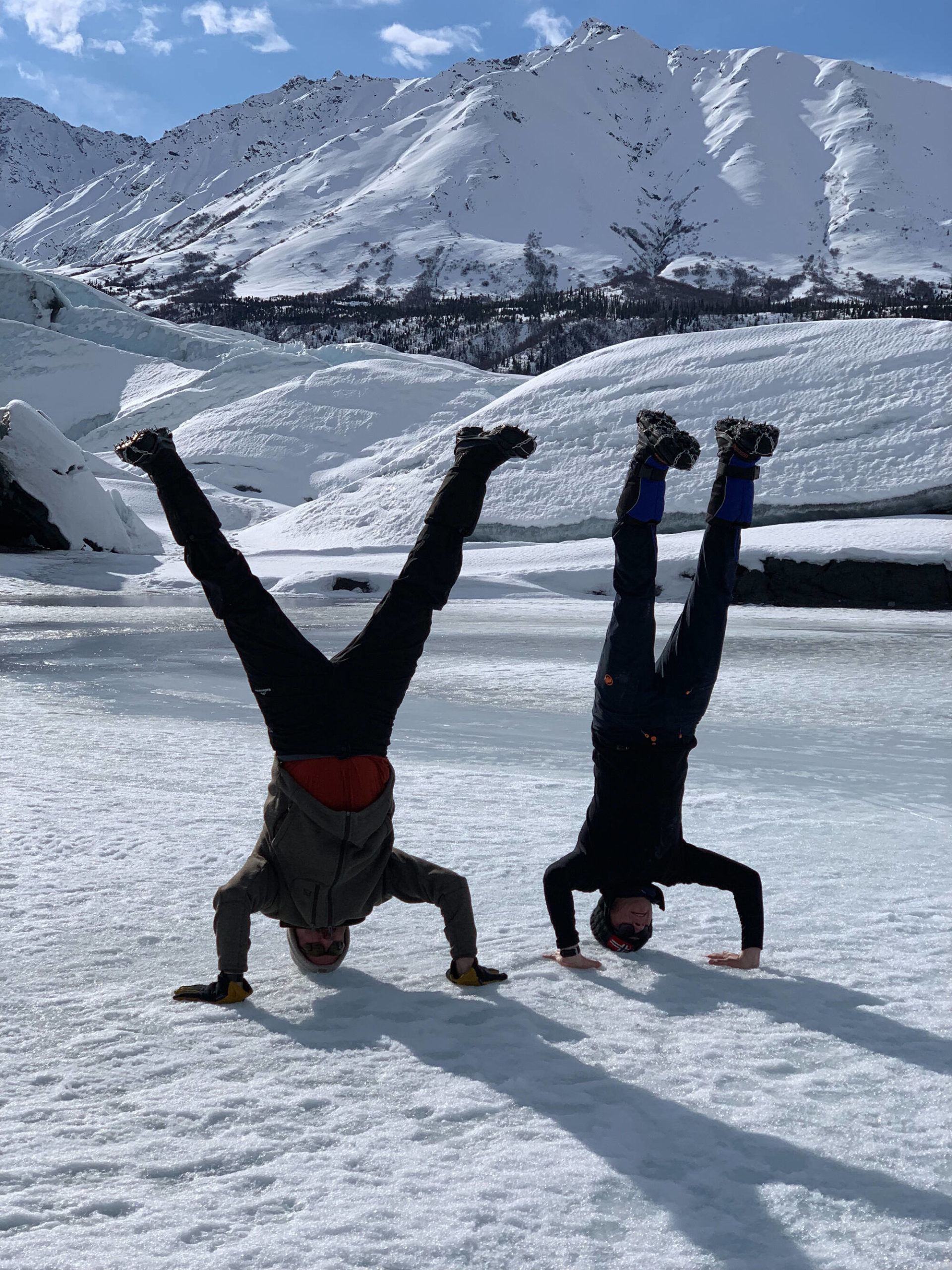 matanuska glacier tour men handstanding