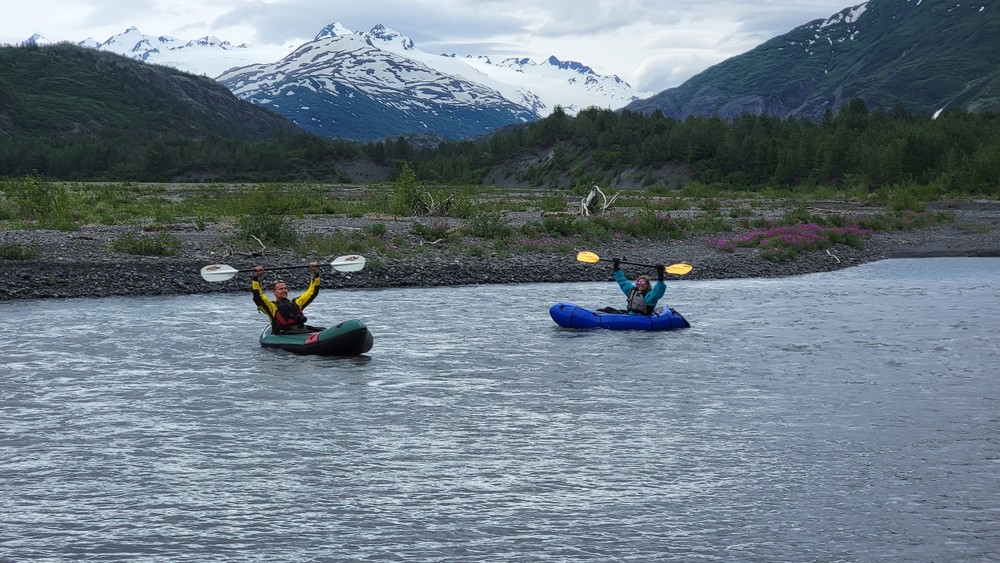 Two guests enjoy a packrafting adventure in Alaska