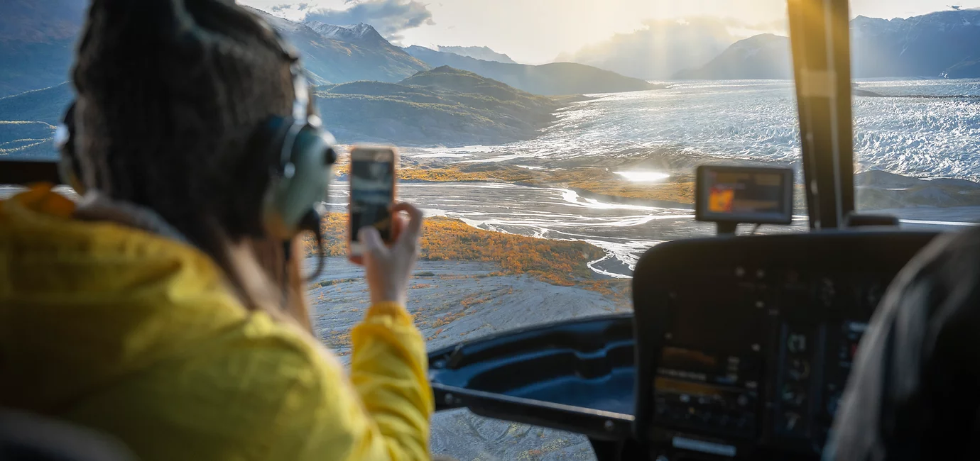 Taking pictures of Alaska glacier from helicopter