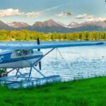a float plane by a body of water near Anchorage, Alaska