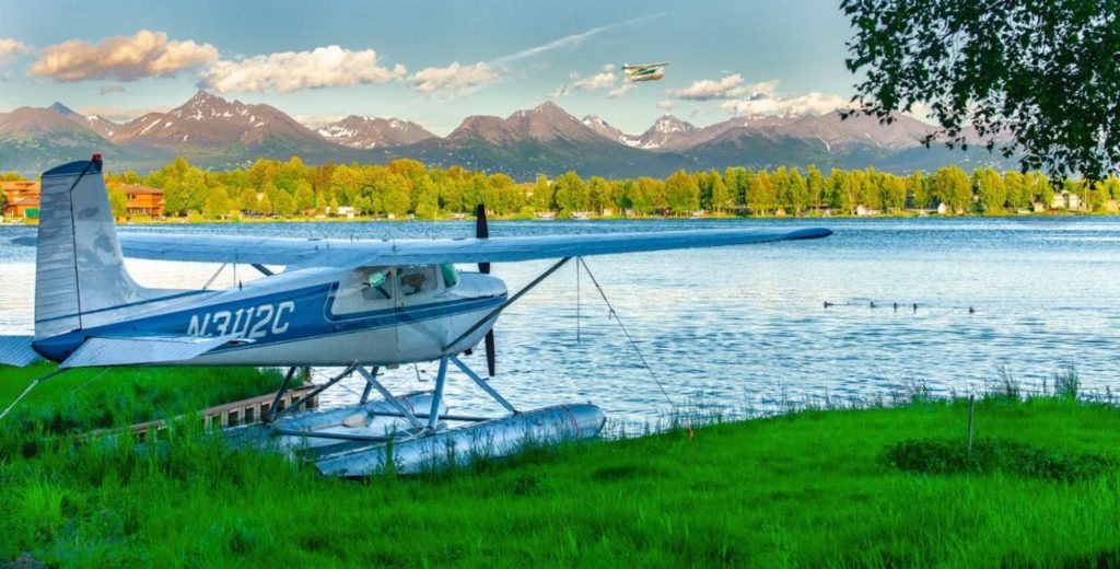 a float plane by a body of water near Anchorage, Alaska
